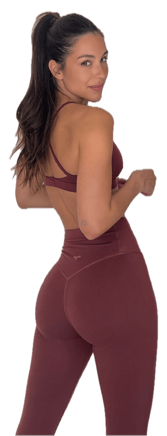 A woman in a rose training set looking back over her shoulder